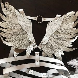 Incredible laser cut white leather harness wings